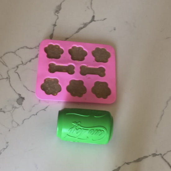 video of dog eating pupsicles from soda can treat holder